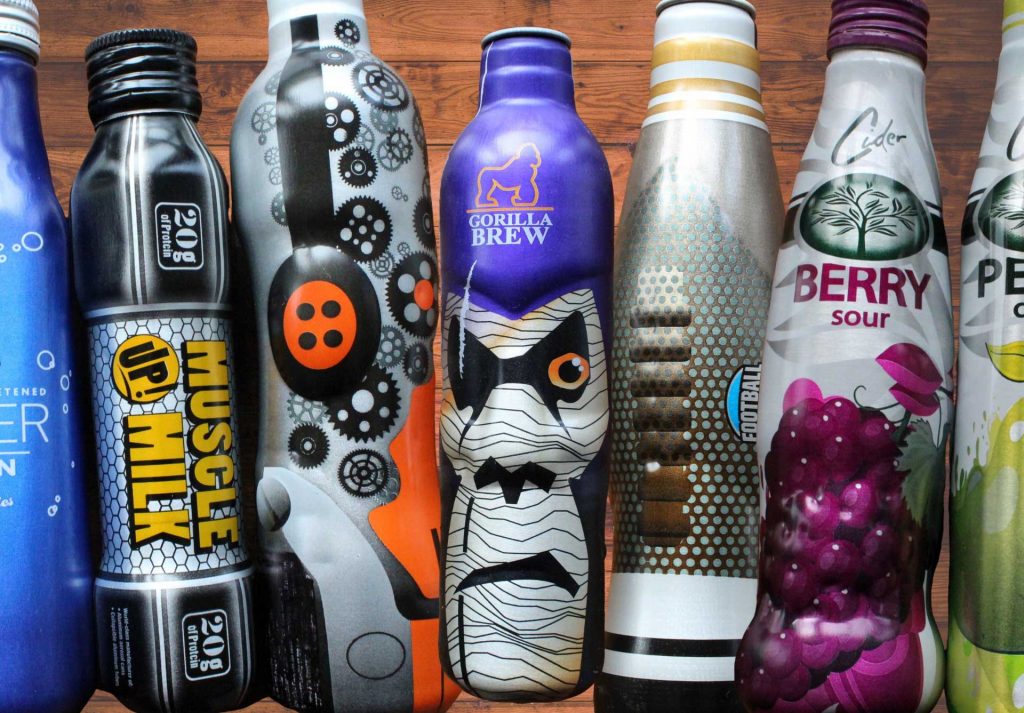 A lineup of custom printed KAT aluminum bottles including Muscle Up Milk, Gorilla Brew, and Berry Sour cider