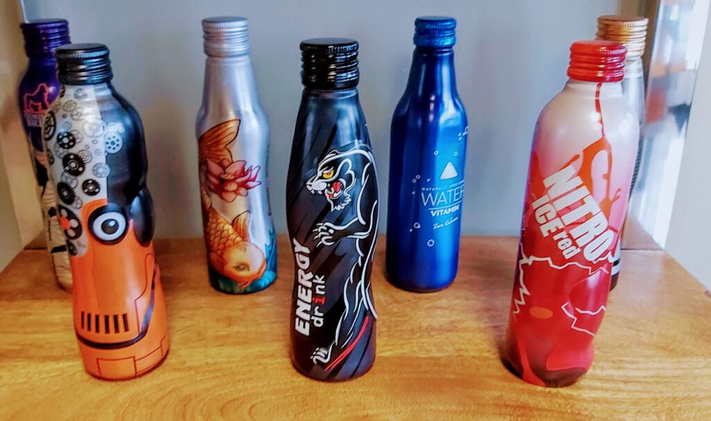 Custom aluminum bottles in printed designs and custom shapes made by Kingston Aluminum Technology